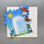 Προσκλητήριο βάπτισης μαγνήτης - κορνίζα με θέμα στρουμφάκια και φάκελος - κουτί.