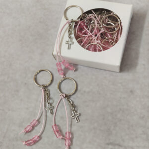 Μαρτυρικά βάπτισης μπρελόκ τύπου κομπολόι σε ροζ απόχρωση με χάντρες  και σταυρό σε κουτί 25 τεμαχίων. 