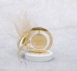 Μπομπονιέρα γάμου - βάπτισης Κωνσταντινάτο από χρυσό καθρέφτη plexi-glass και σοκολά τούλι με χρυσό glitter.