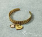 Μαρτυρικό βραχιόλι βάπτισης απο ανοξείδωτο ατσάλι σε χρυσό χρώμα με σταυρουδάκι και καρδιά από χρυσό καθρέφτη plexiglass.