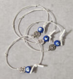 Μαρτυρικά βάπτισης βραχιόλια με ξύλινο ζωγραφισμένο μάτι και περίτεχνο σταυρό ασημί κωνσταντινάτο και λευκό στρας.