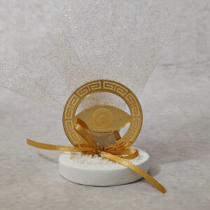 Μπομπονιέρα γάμου από χρυσό καθρέφτη plexi-glass με χάραξη και μάτι.